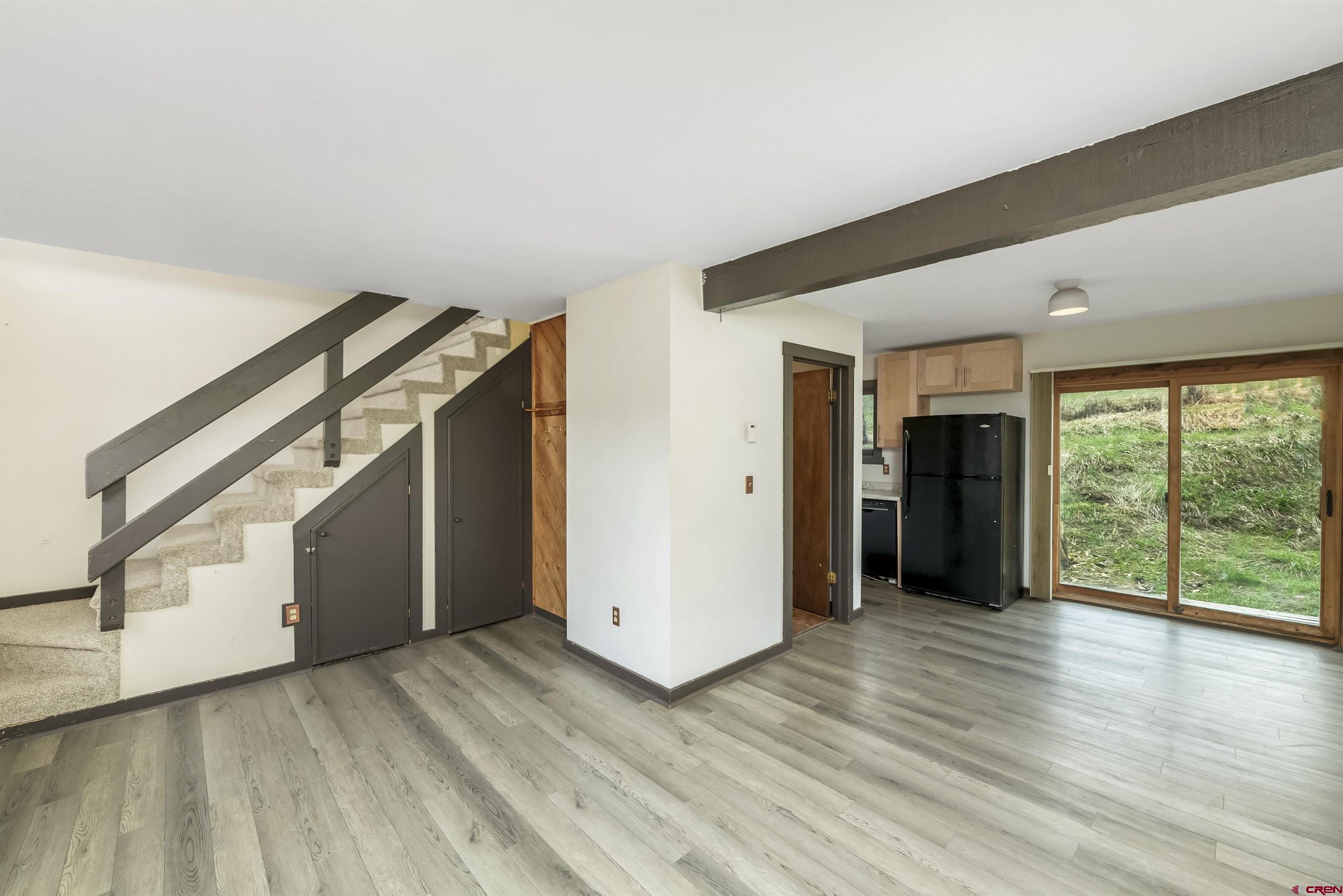 22 Castle Road, Unit 2 Crested Butte, CO 81225 - Photo 4 of 34 a view of an empty room with glass door