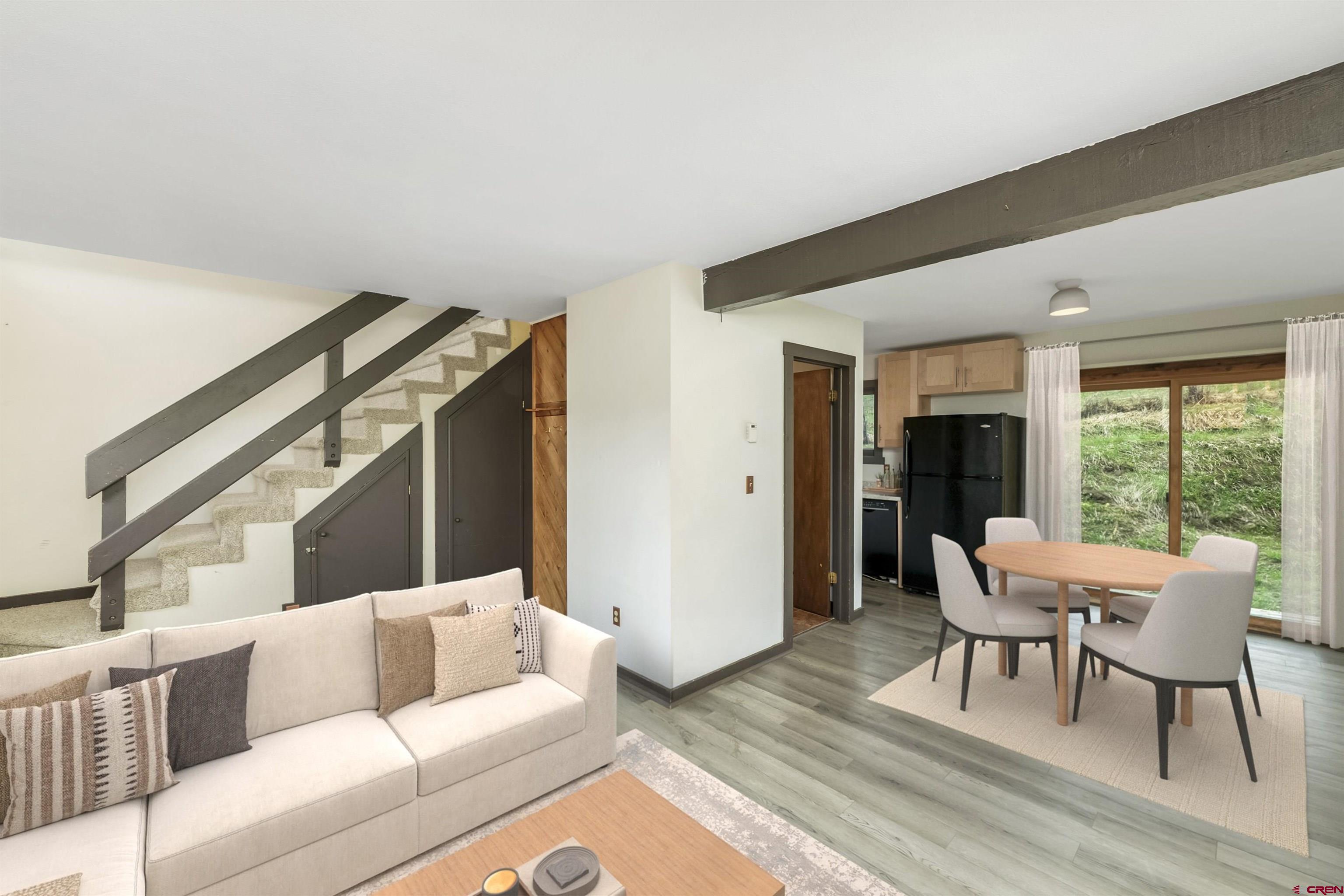 22 Castle Road, Unit 2 Crested Butte, CO 81225 - Photo 5 of 34 a living room with furniture and a large window