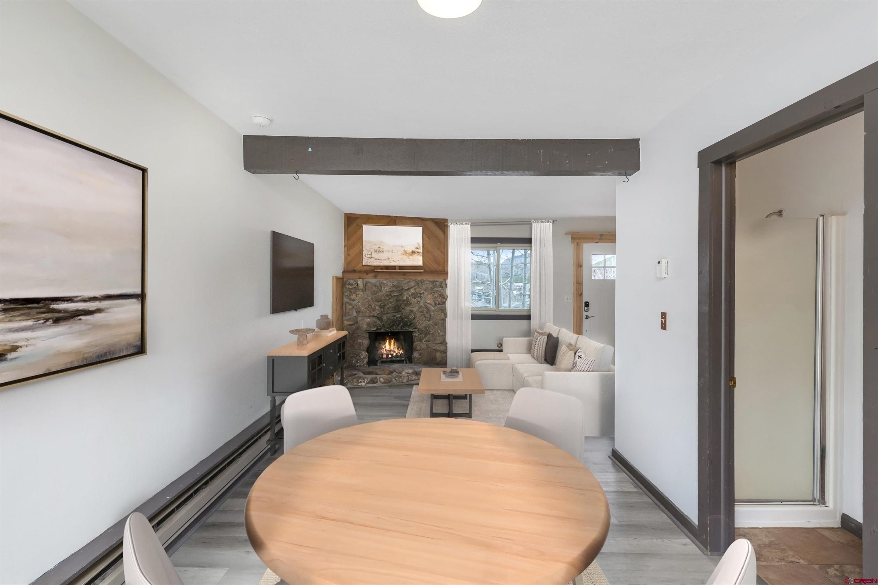 22 Castle Road, Unit 2 Crested Butte, CO 81225 - Photo 10 of 34 a living room with furniture and a mirror