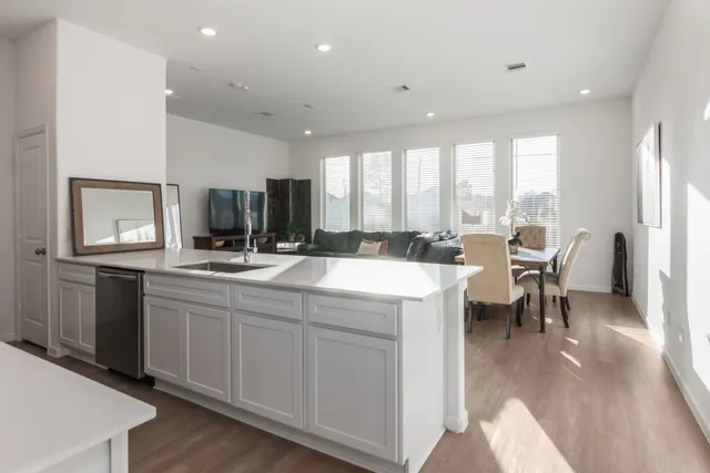 a living room with furniture and windows