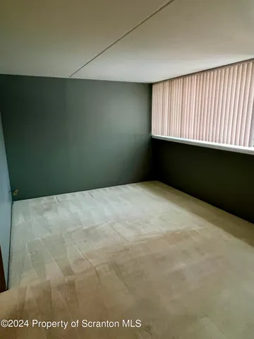 a view of a room with a large window