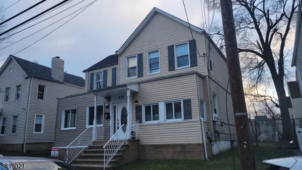 a kitchen with cabinets stainless steel appliances and a sink