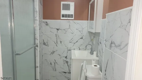 an empty room with wooden floor and a window