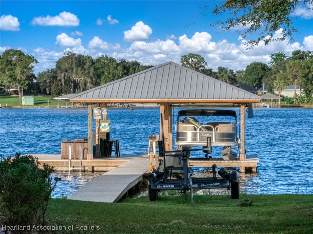 59 Twin Lakes Road Lake Placid, FL 33852 - Photo 39 of 45 Your own boat house with lift and sun deck. JUMP IN! the waters amazing!