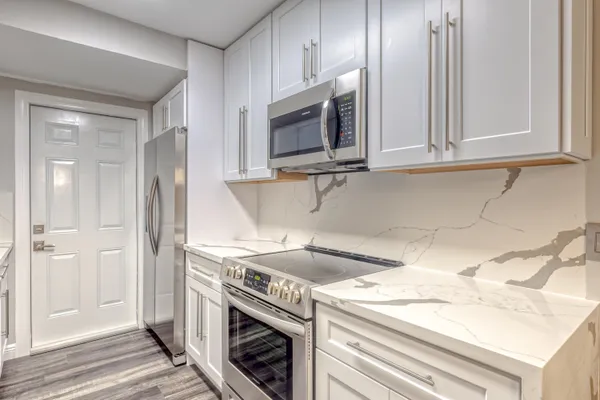 a kitchen with a stove and a microwave