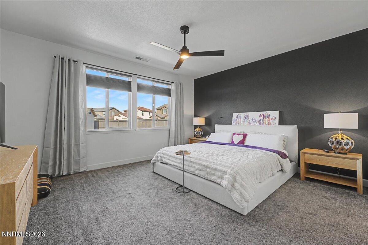 6997 Spencer Ridge Court Sparks, NV 89436 - Photo 12 of 38 a bedroom with a large bed and a window