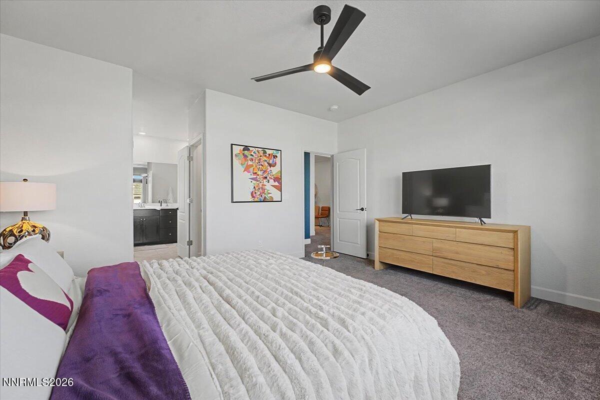 6997 Spencer Ridge Court Sparks, NV 89436 - Photo 14 of 38 a bedroom with a bed and a television