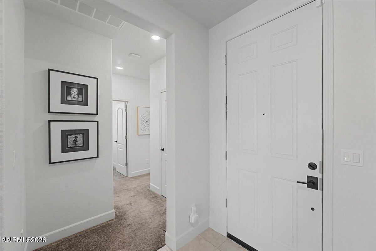 6997 Spencer Ridge Court Sparks, NV 89436 - Photo 24 of 38 a view of a hallway with front door