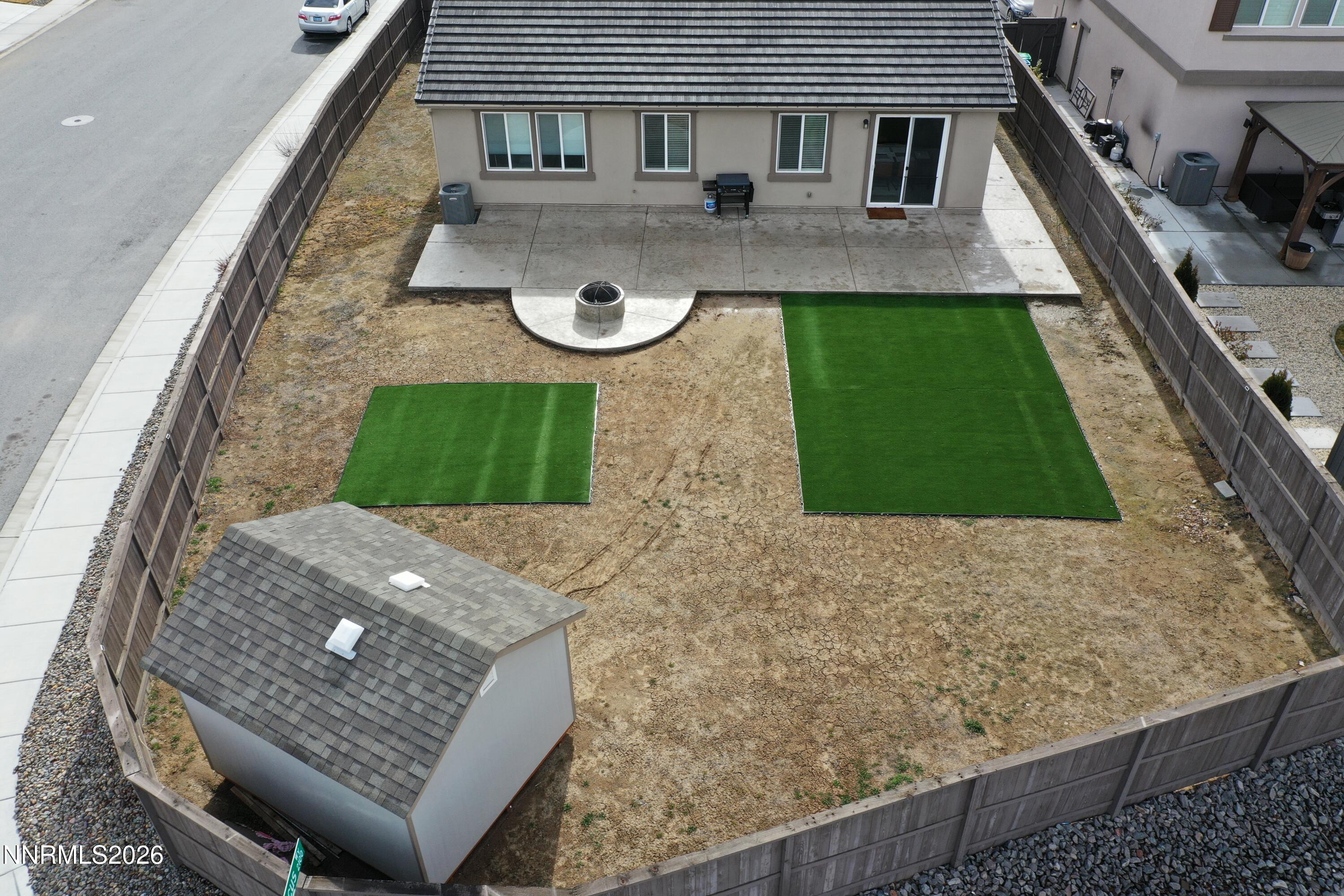 6997 Spencer Ridge Court Sparks, NV 89436 - Photo 34 of 38 a backyard of a house with seating space