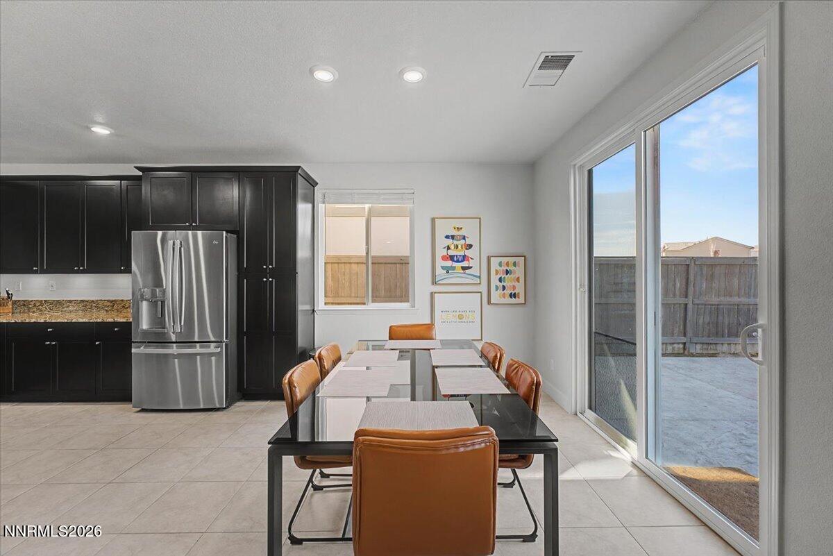 6997 Spencer Ridge Court Sparks, NV 89436 - Photo 7 of 38 a dining room with furniture and large windows