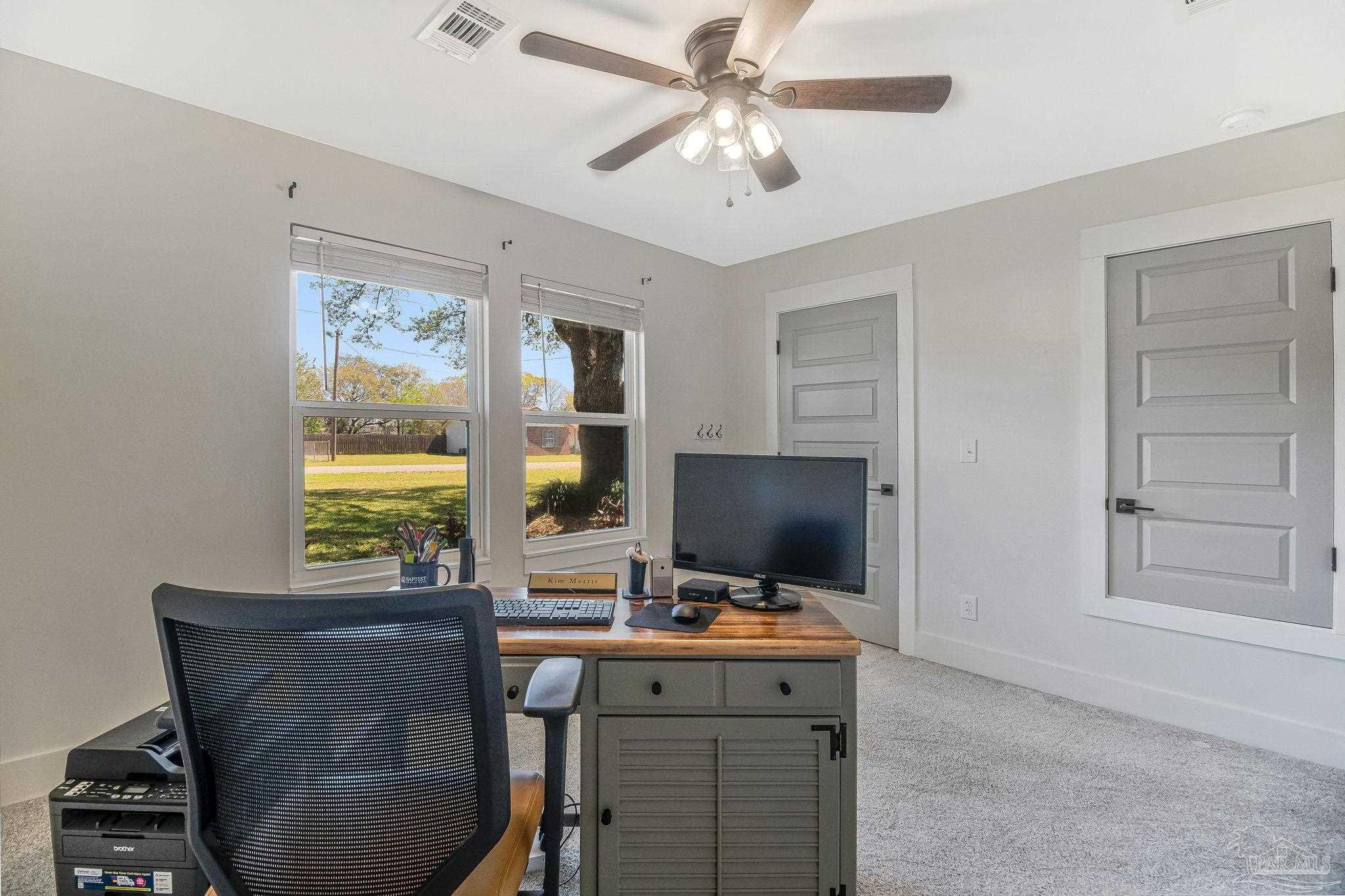7175 Wallace Drive Pace, FL 32571 - Photo 45 of 71 a view of a workspace with furniture and a window