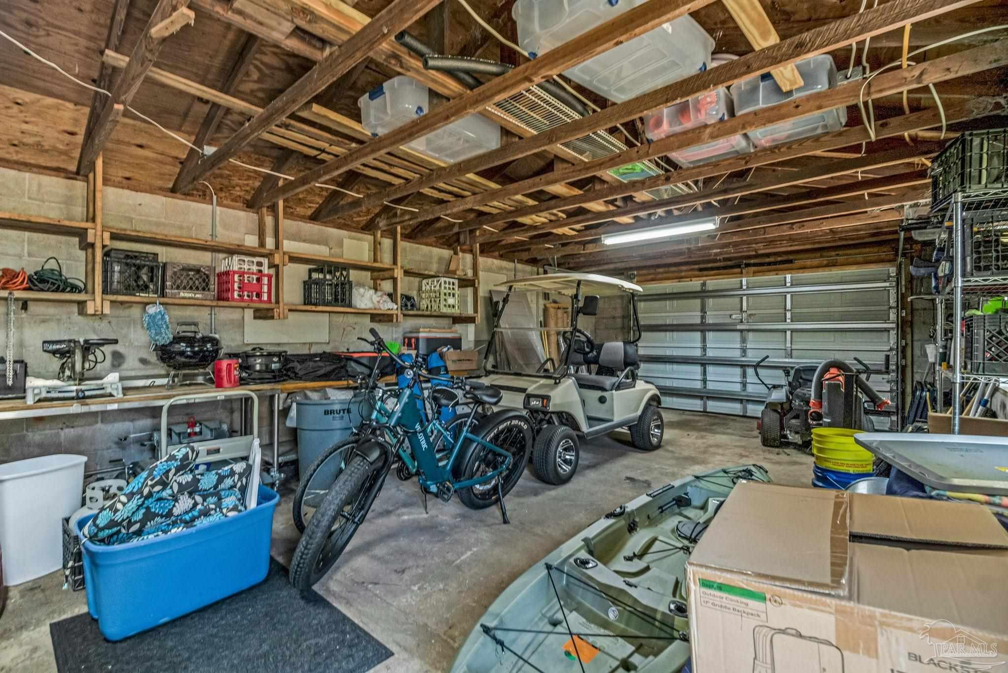 7175 Wallace Drive Pace, FL 32571 - Photo 53 of 71 a view of a storage room with lots of stuff