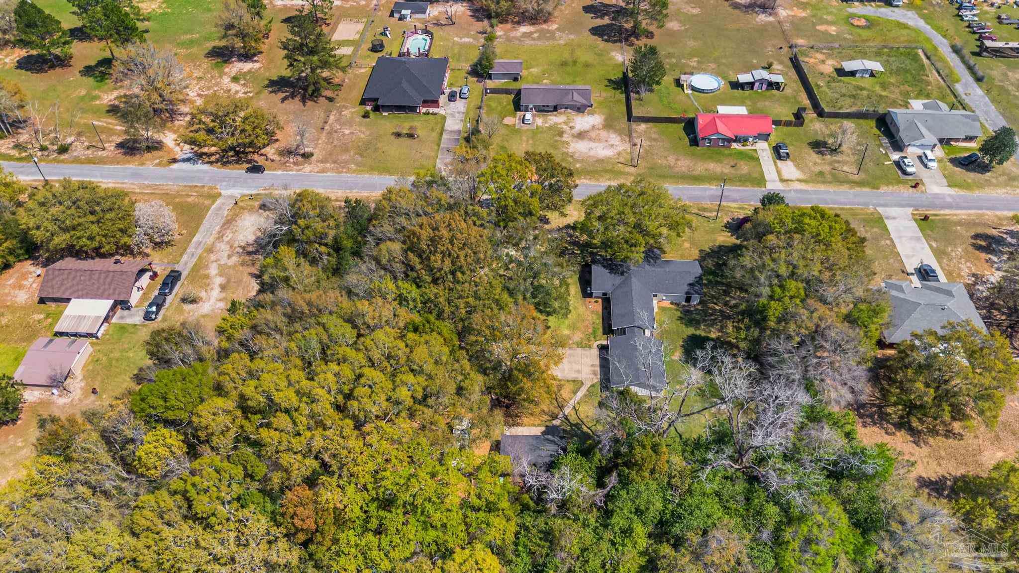 7175 Wallace Drive Pace, FL 32571 - Photo 61 of 71 an aerial view of residential houses with outdoor space