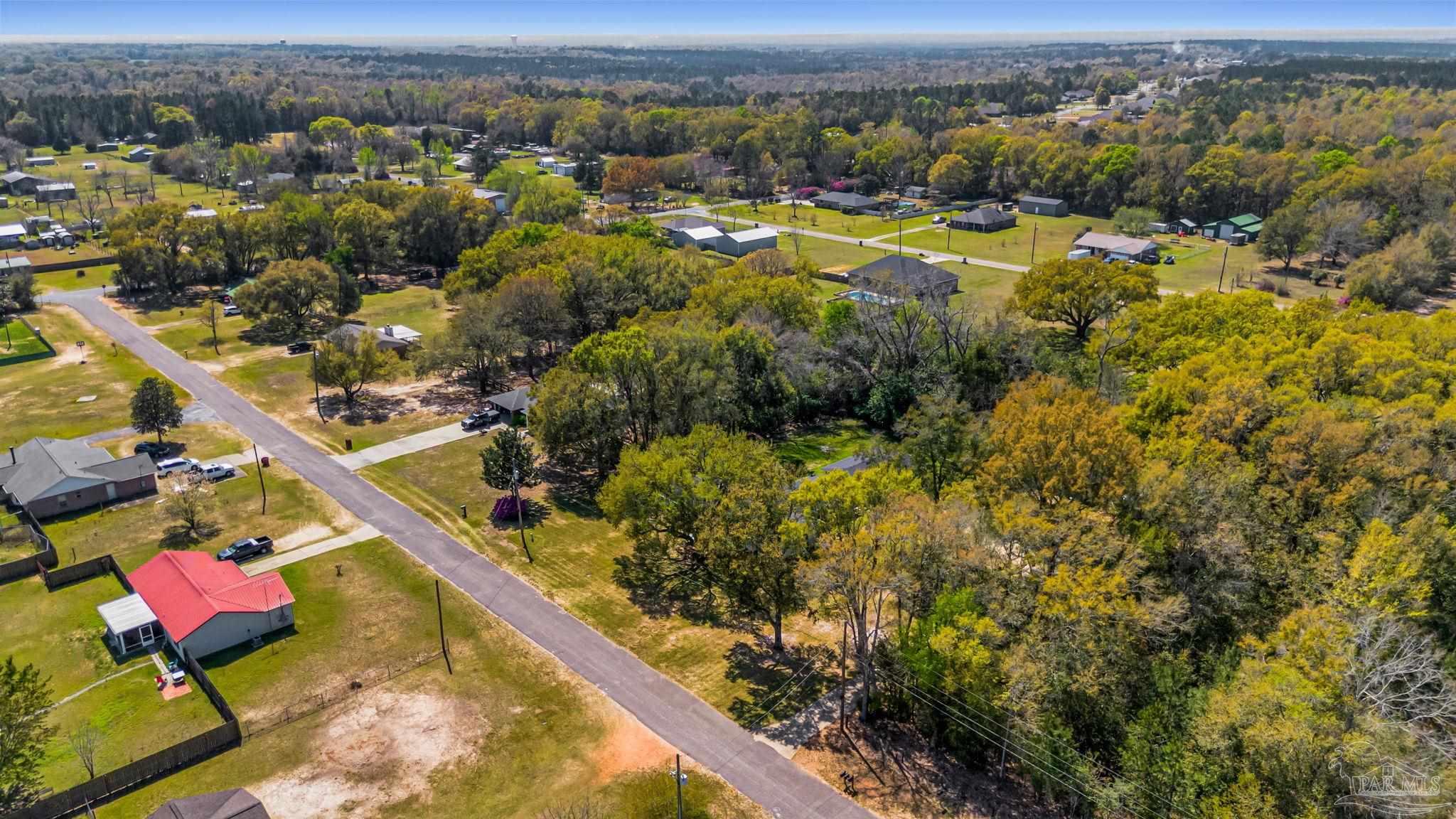 7175 Wallace Drive Pace, FL 32571 - Photo 64 of 71 an aerial view of residential houses with outdoor space