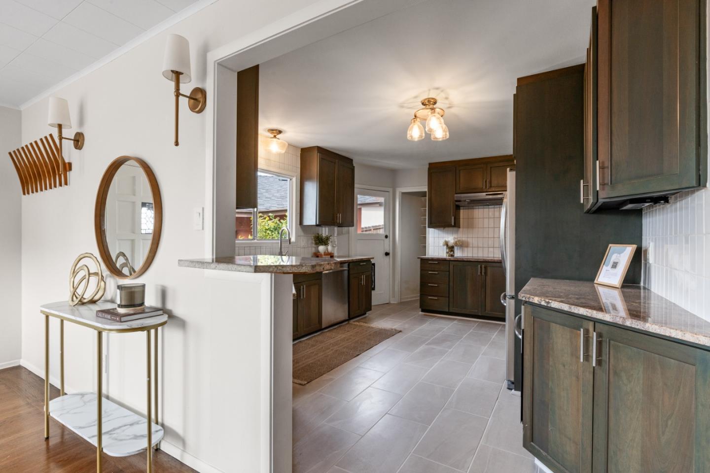 401 Monterey Road Pacifica, CA 94044 - Photo 13 of 39 a kitchen with a sink cabinets and window