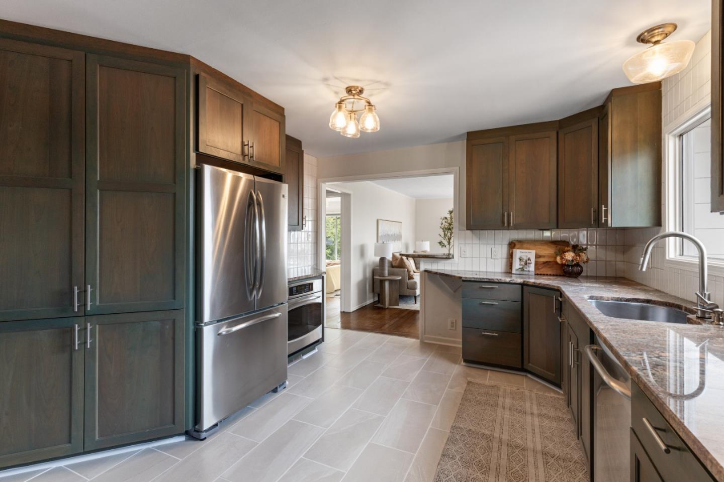 401 Monterey Road Pacifica, CA 94044 - Photo 14 of 39 a kitchen with granite countertop a refrigerator and a sink