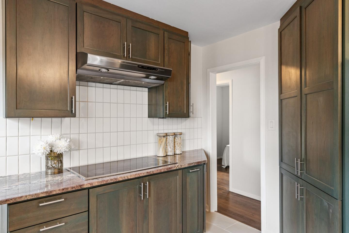 401 Monterey Road Pacifica, CA 94044 - Photo 15 of 39 a kitchen with granite countertop stainless steel appliances a sink and a refrigerator