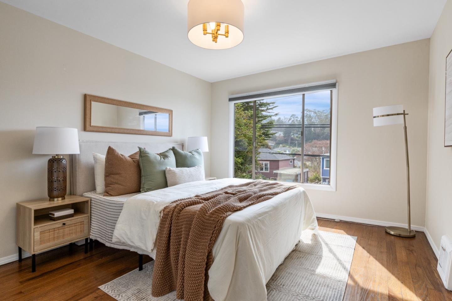 401 Monterey Road Pacifica, CA 94044 - Photo 17 of 39 a bedroom with a bed and a tv on a dresser