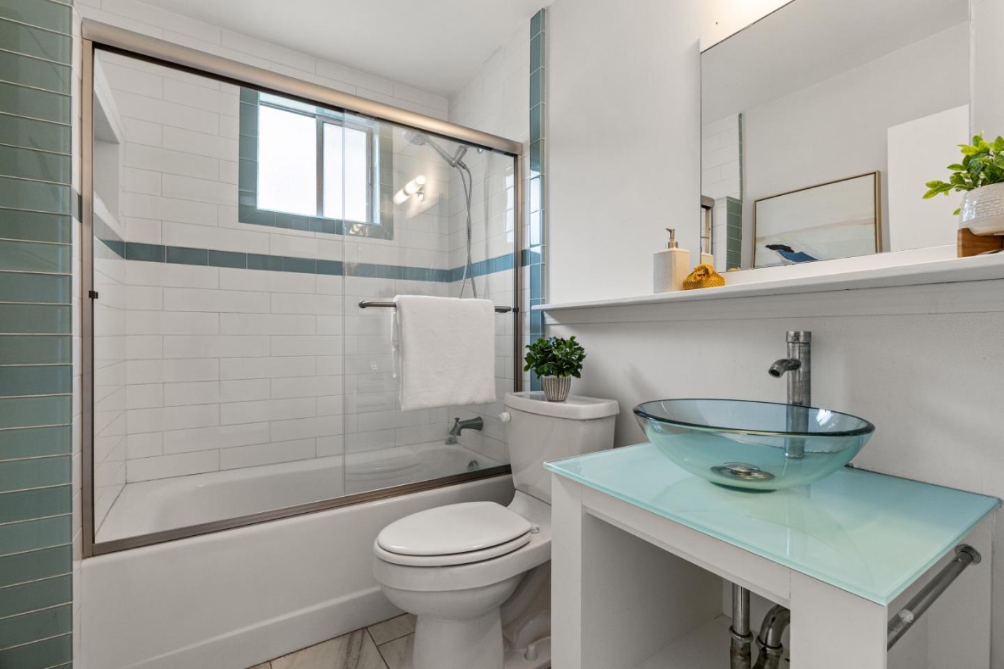 401 Monterey Road Pacifica, CA 94044 - Photo 22 of 39 a bathroom with a sink a toilet and shower