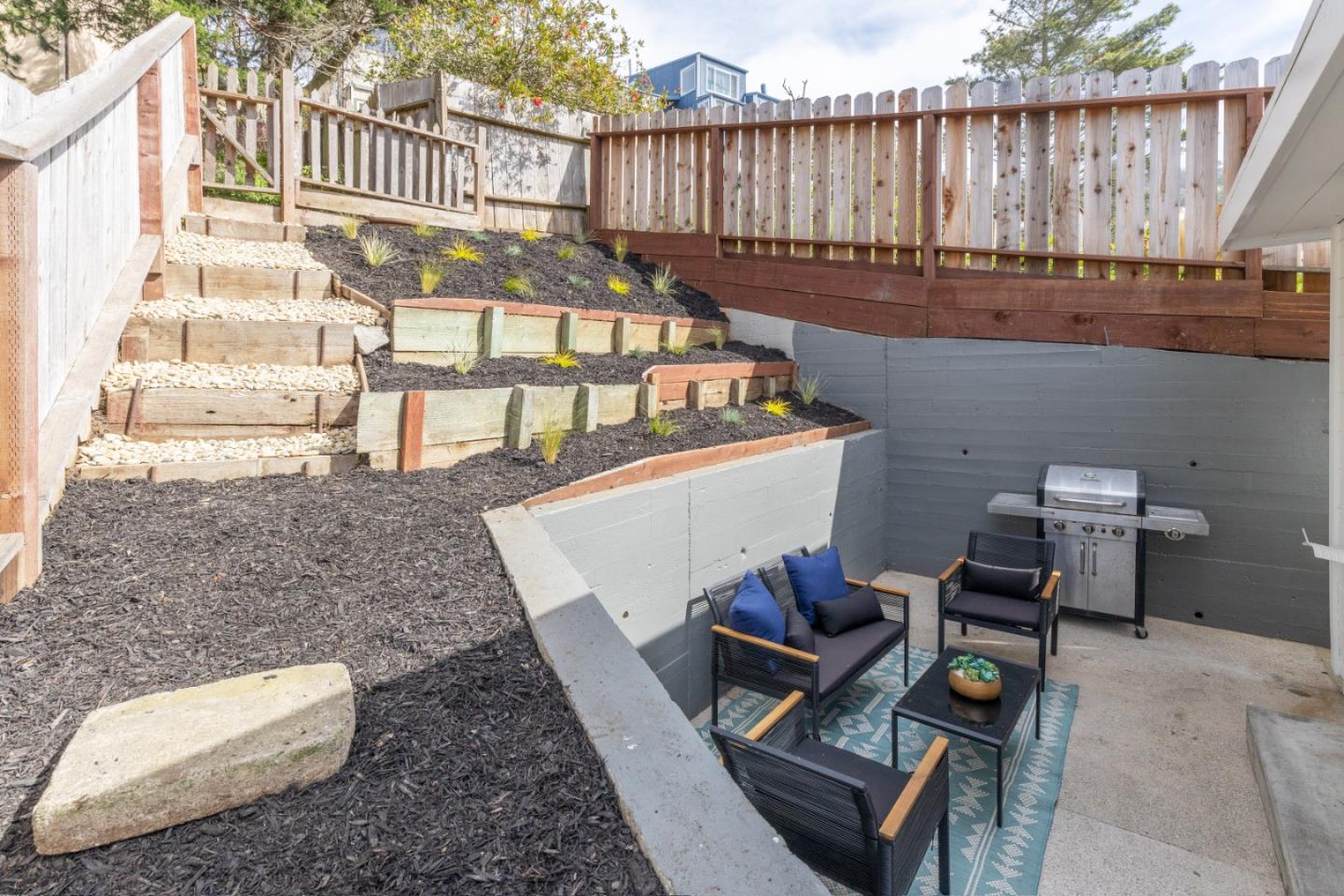 401 Monterey Road Pacifica, CA 94044 - Photo 27 of 39 a view of a chairs and table in the patio