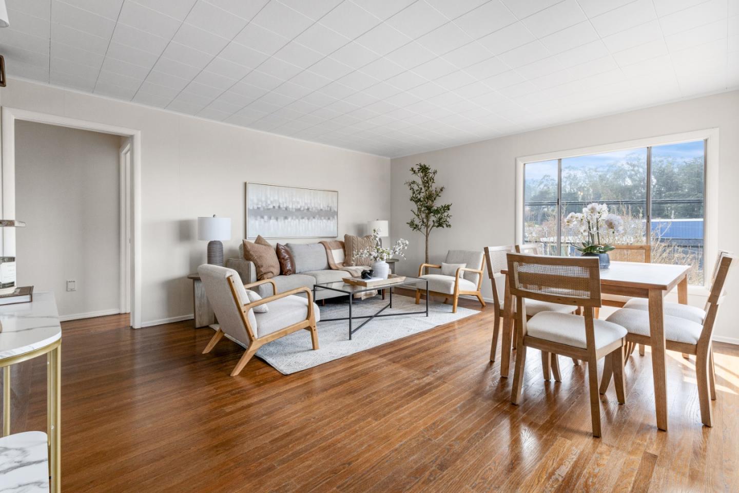 401 Monterey Road Pacifica, CA 94044 - Photo 4 of 39 a living room with furniture and a wooden floor