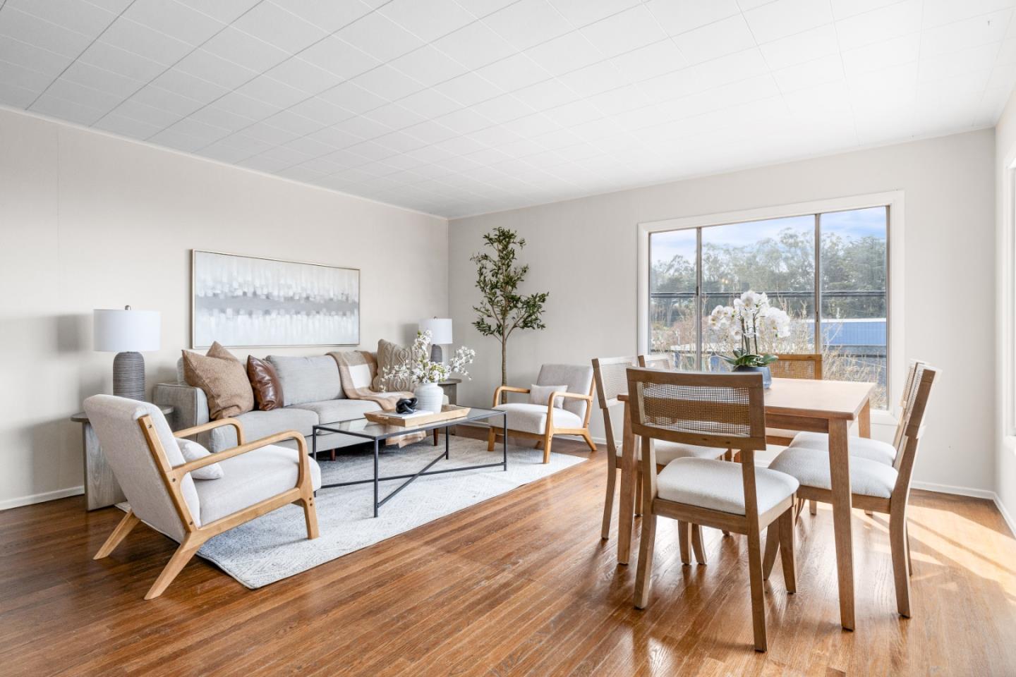 401 Monterey Road Pacifica, CA 94044 - Photo 6 of 39 a living room with furniture a table and a large window
