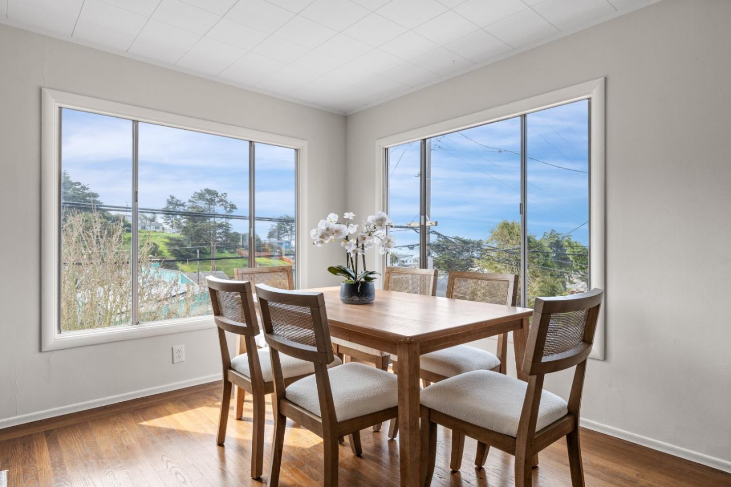 401 Monterey Road Pacifica, CA 94044 - Photo 8 of 39 a dining room with furniture window and wooden floor