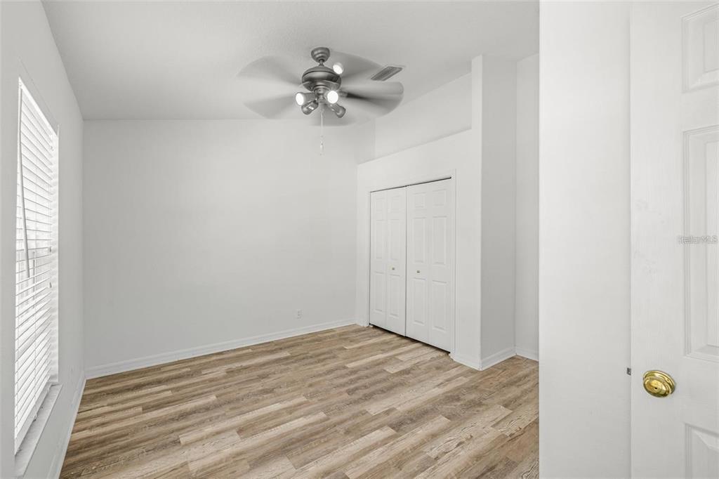 8010 Thoroughbred Loop Largo, FL 33773 - Photo 15 of 29 a view of an empty room