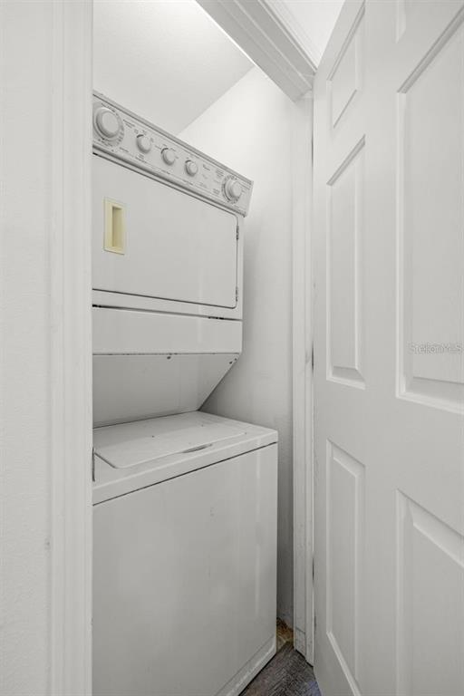 8010 Thoroughbred Loop Largo, FL 33773 - Photo 22 of 29 a utility room with dryer and washer