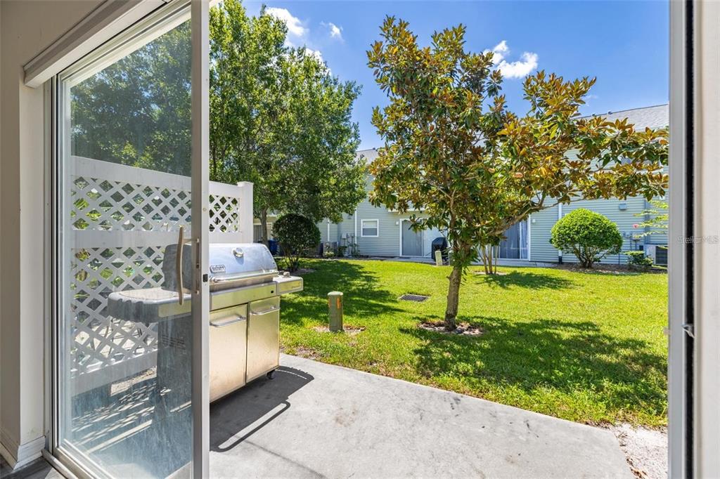 8010 Thoroughbred Loop Largo, FL 33773 - Photo 23 of 29 a house view with a garden space