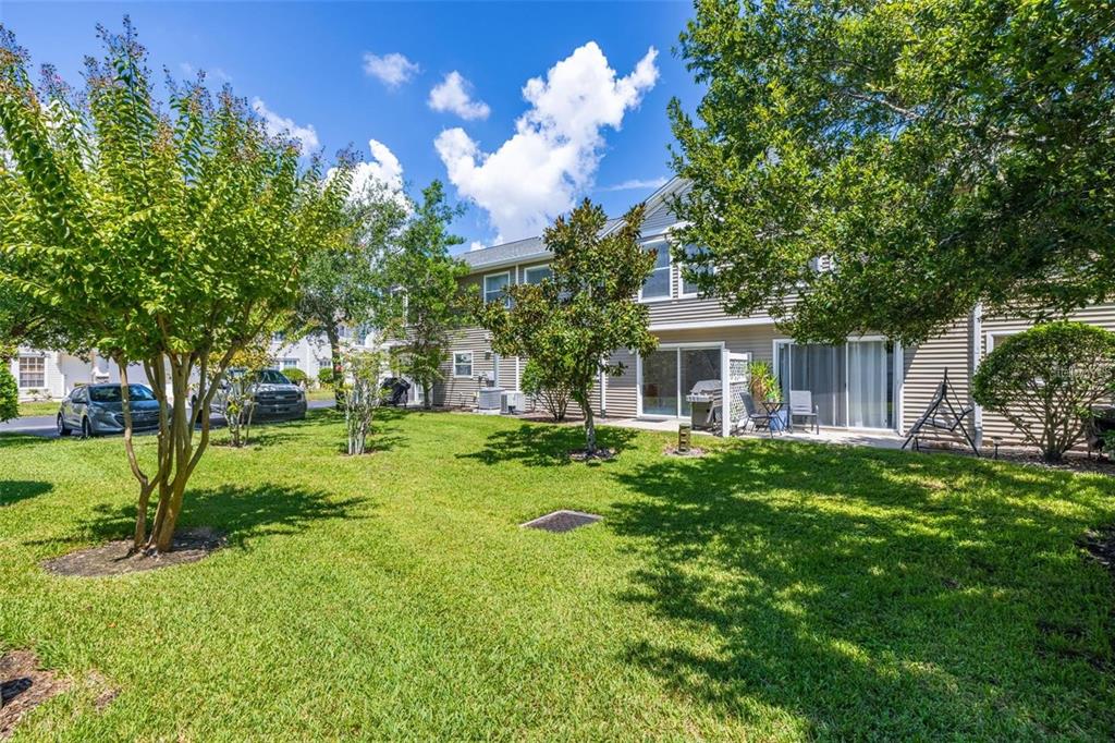 8010 Thoroughbred Loop Largo, FL 33773 - Photo 26 of 29 a view of house with backyard