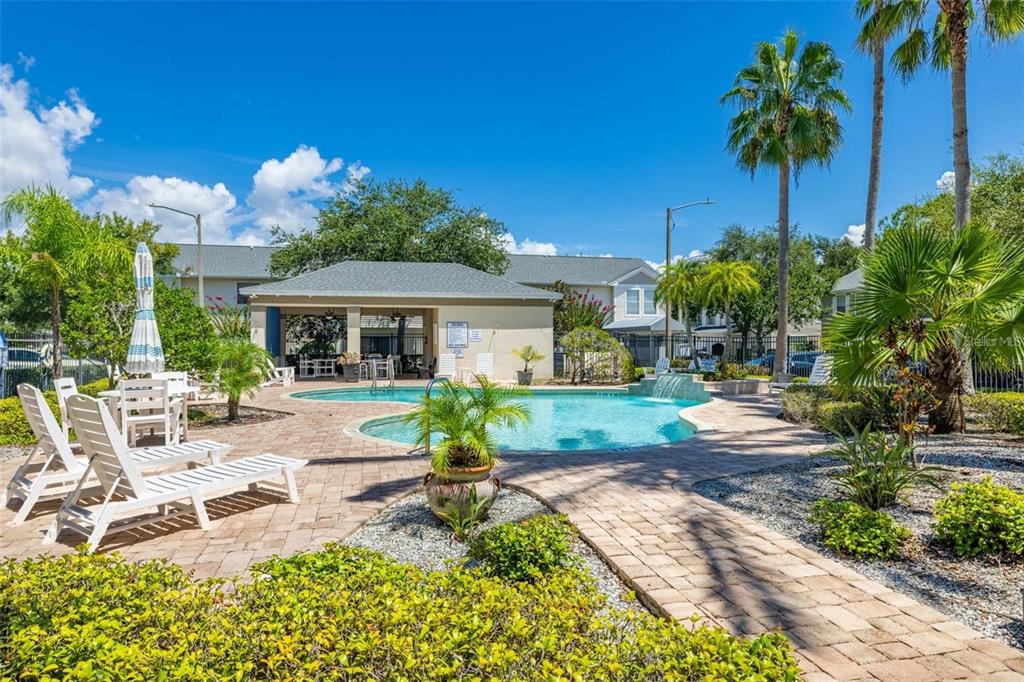 8010 Thoroughbred Loop Largo, FL 33773 - Photo 28 of 29 a view of a house with backyard and sitting area