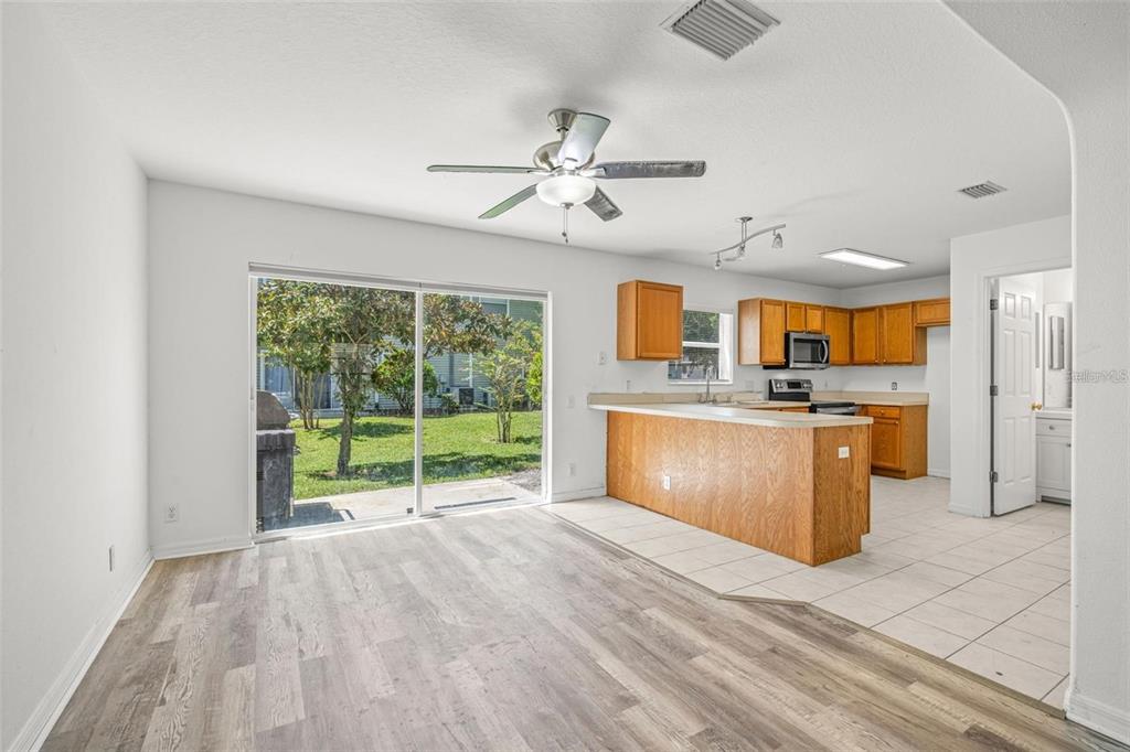 8010 Thoroughbred Loop Largo, FL 33773 - Photo 4 of 29 a view of a kitchen with a sink and a window