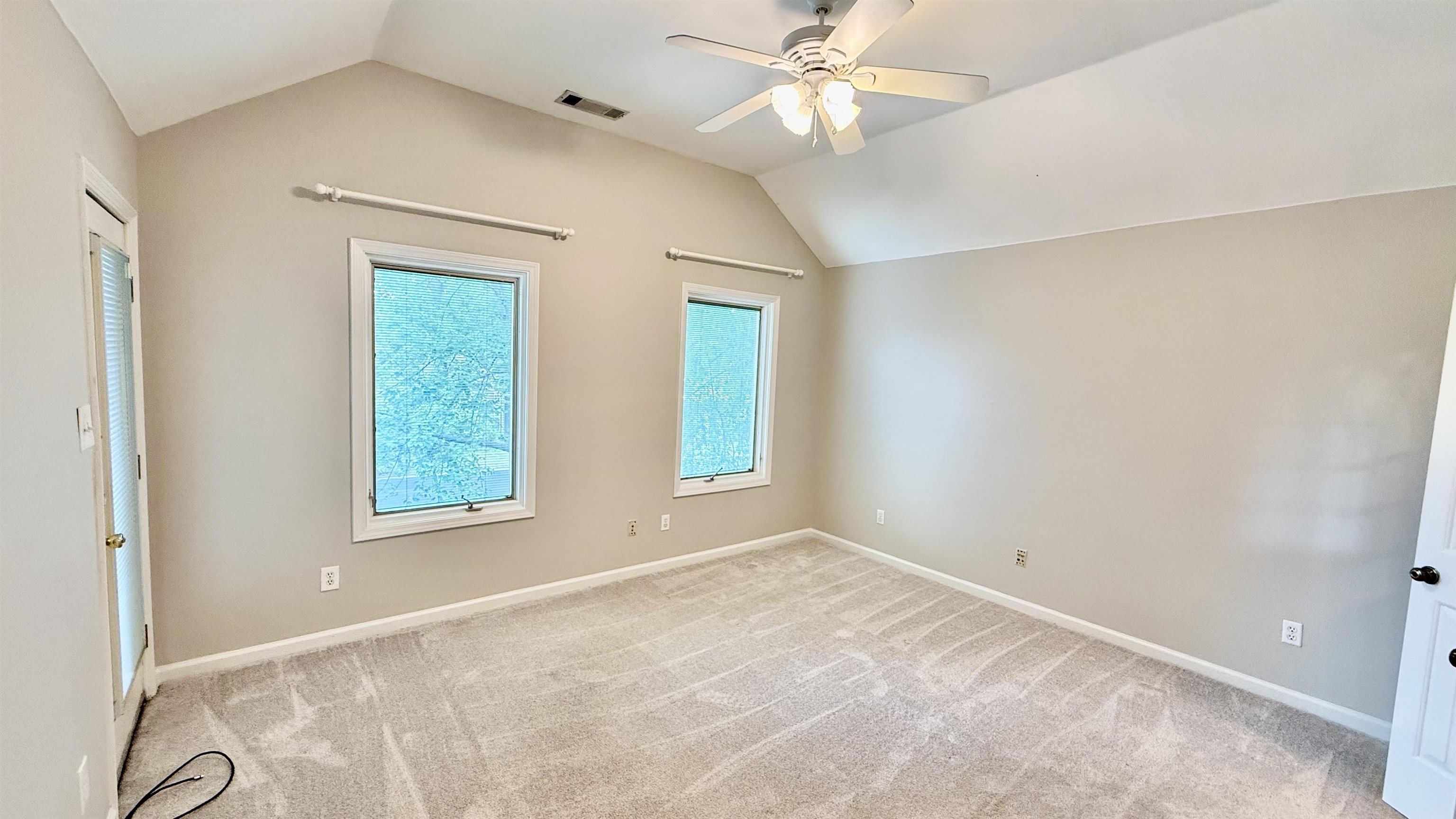 184 Marrakesh Circle Memphis, TN 38103 - Photo 14 of 34 an empty room with windows and fan