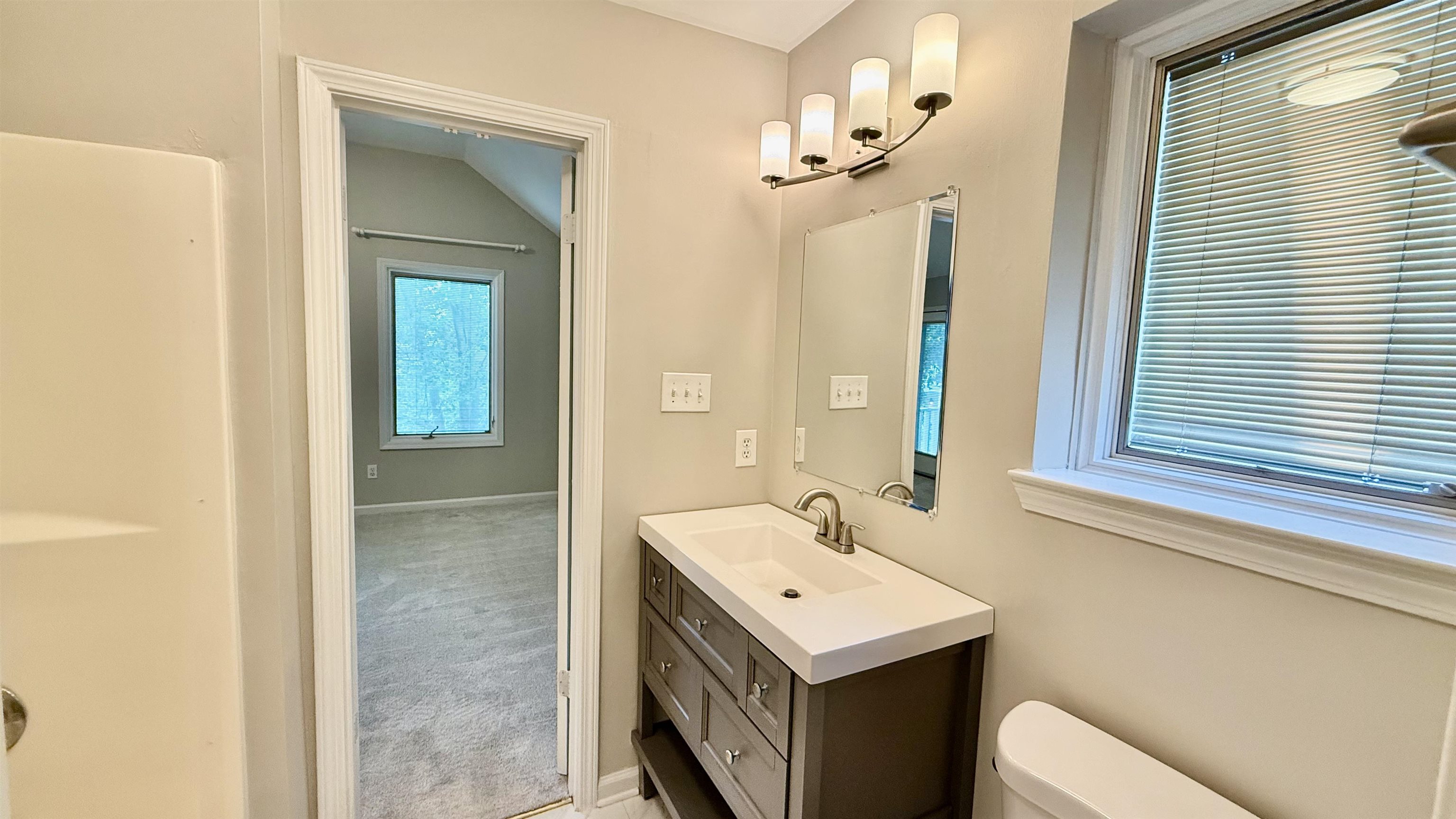 184 Marrakesh Circle Memphis, TN 38103 - Photo 17 of 34 a bathroom with a sink and a mirror