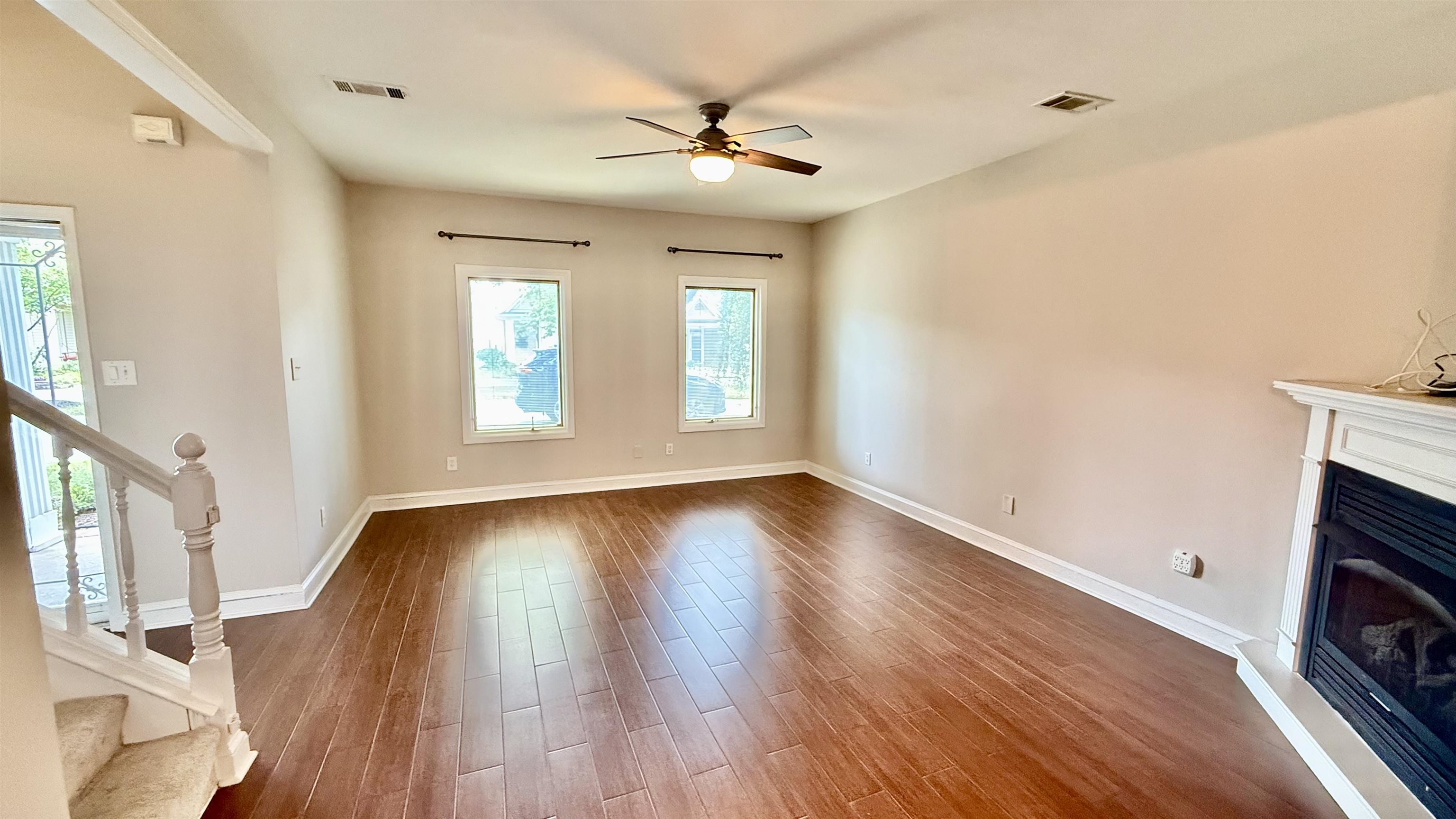 184 Marrakesh Circle Memphis, TN 38103 - Photo 6 of 34 a view of an empty room with window and wooden floor