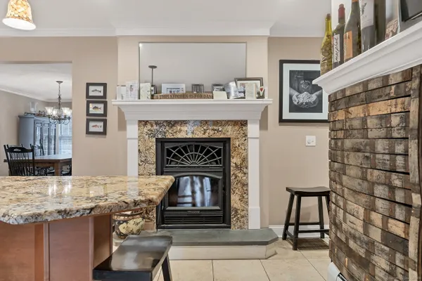 a living room with granite countertop furniture and a fireplace
