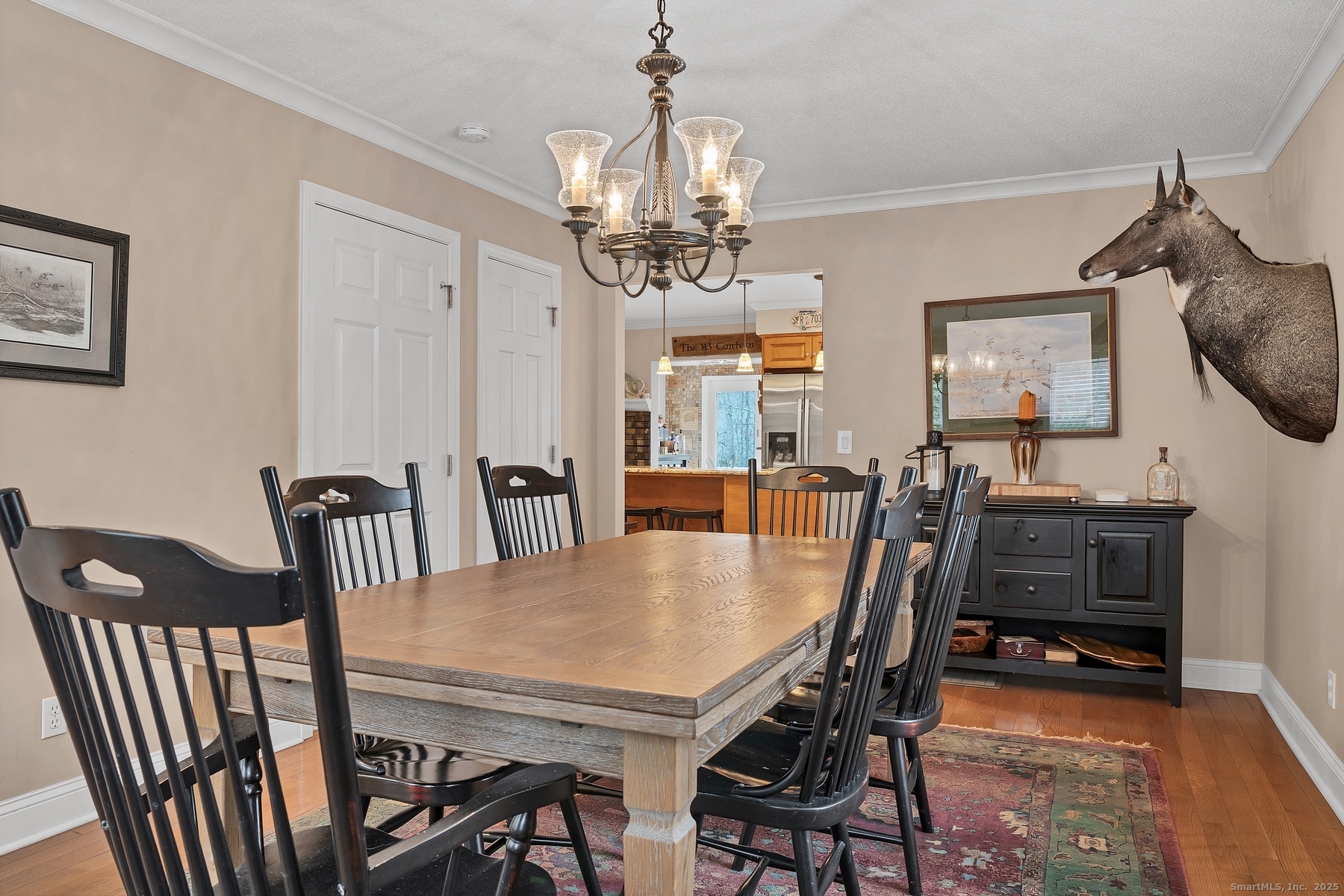 113 Flat Rock Road Branford, CT 06405 - Photo 16 of 39 a view of a dining room with furniture and wooden floor