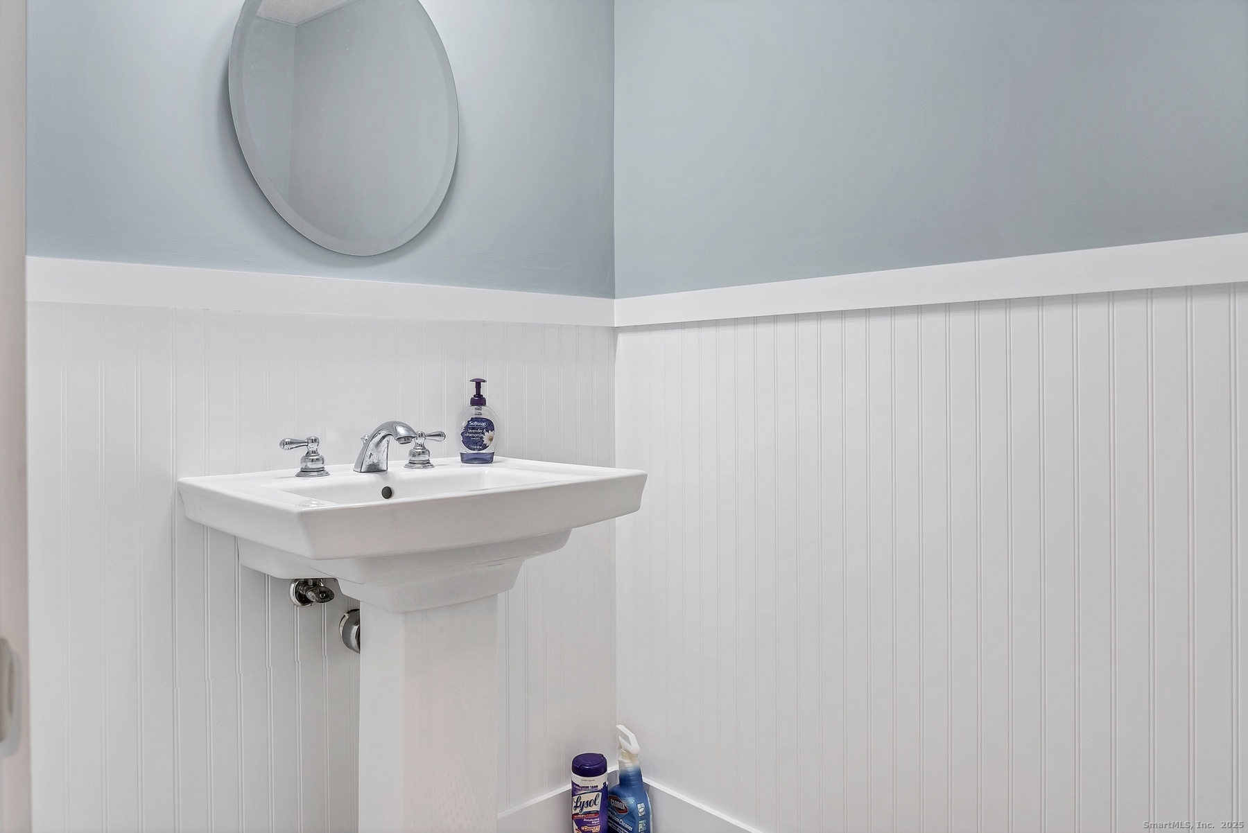 113 Flat Rock Road Branford, CT 06405 - Photo 19 of 39 a bathroom with a sink and a mirror