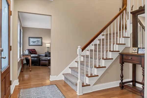 a view of a livingroom with furniture and stairs