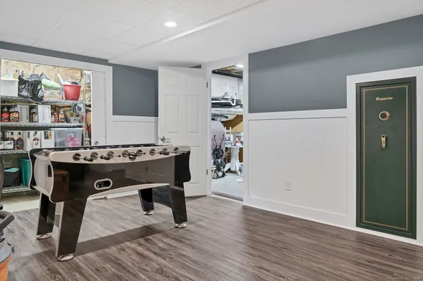 a view of work space with furniture and wooden floor