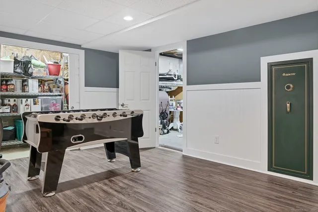 a view of work space with furniture and wooden floor