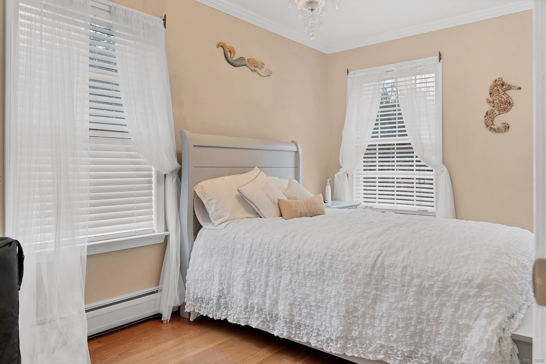 113 Flat Rock Road Branford, CT 06405 - Photo 22 of 39 a bedroom with a bed and a window