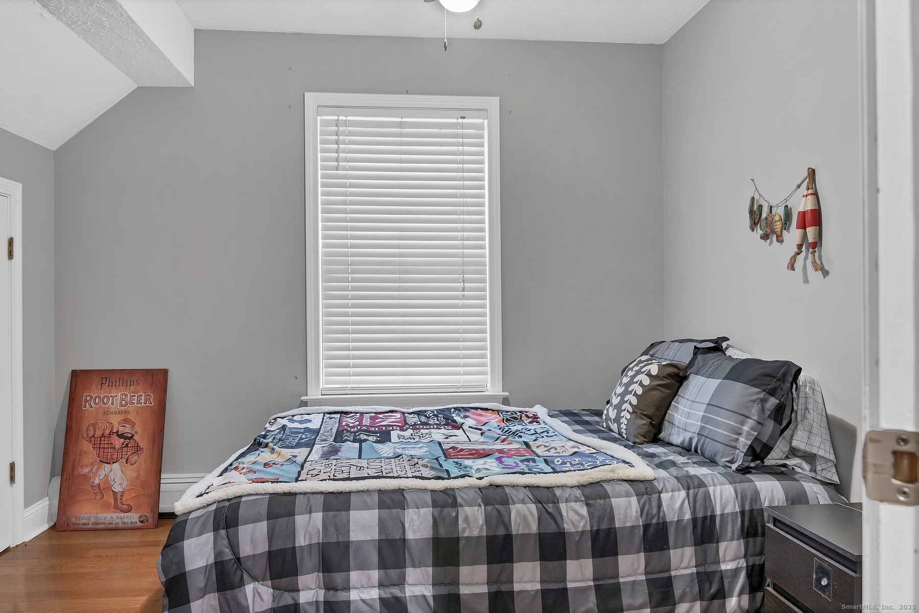 113 Flat Rock Road Branford, CT 06405 - Photo 24 of 39 a bedroom with a bed and a window