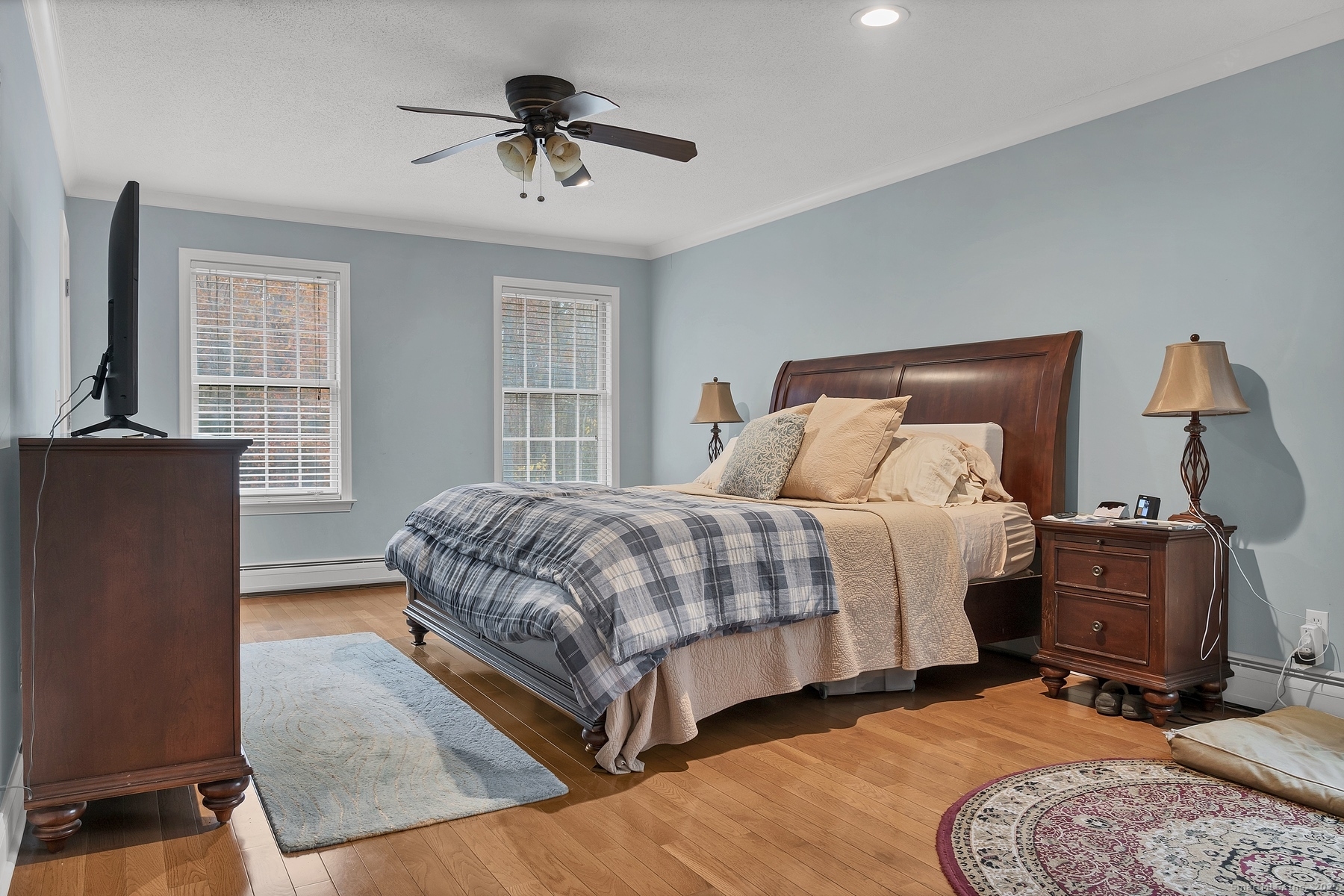 113 Flat Rock Road Branford, CT 06405 - Photo 27 of 39 a bedroom with a bed and wooden floor