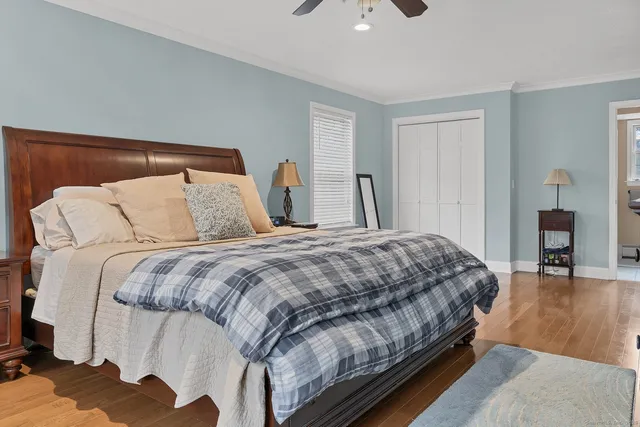 a bedroom with a bed and a lamp