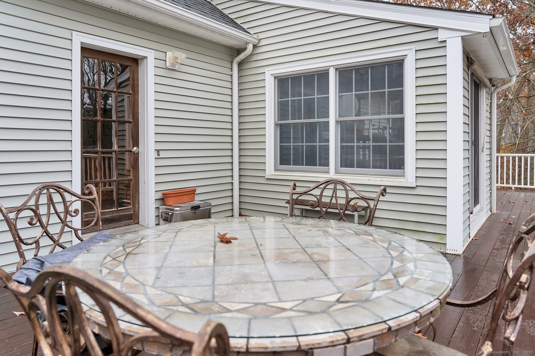 113 Flat Rock Road Branford, CT 06405 - Photo 33 of 39 a view of a balcony with table and chairs