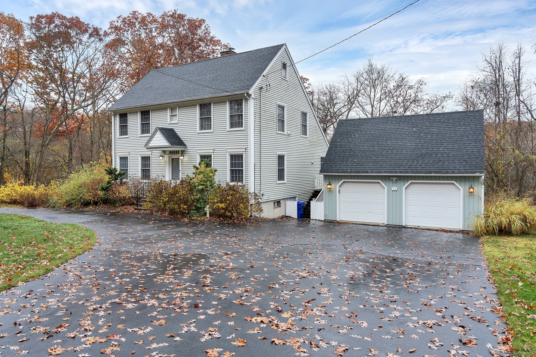 113 Flat Rock Road Branford, CT 06405 - Photo 39 of 39 a view of a white house with a yard and large tree