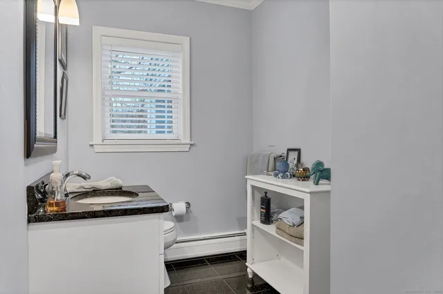 a room with a window and cabinets