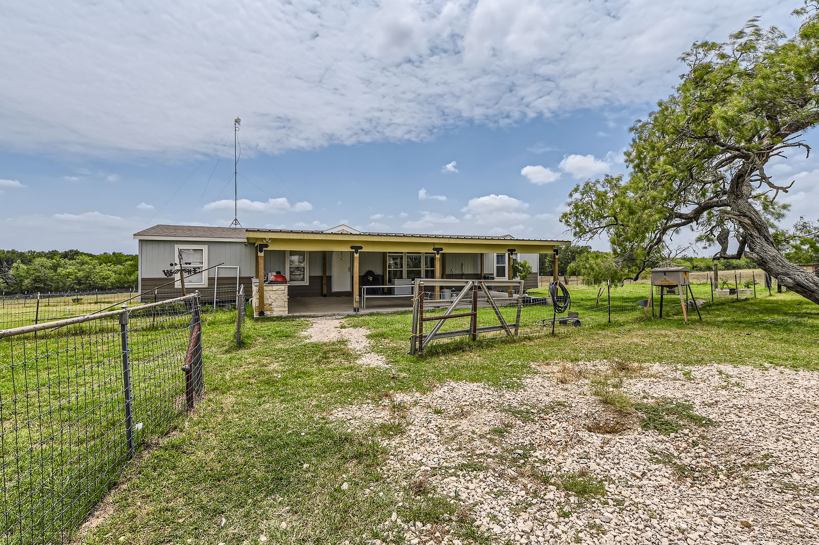 480 Grandpa Road Lockhart, TX 78644 - Photo 6 of 35 The centerpiece is a spacious ~2,061 sq ft manufactured home, just 1.5
years old, with 4 bedrooms, 2 bathrooms, and a beautifully crafted 40' x 20' stone outdoor kitchen under a covered
roof with lighting—ideal for hosting under the stars.